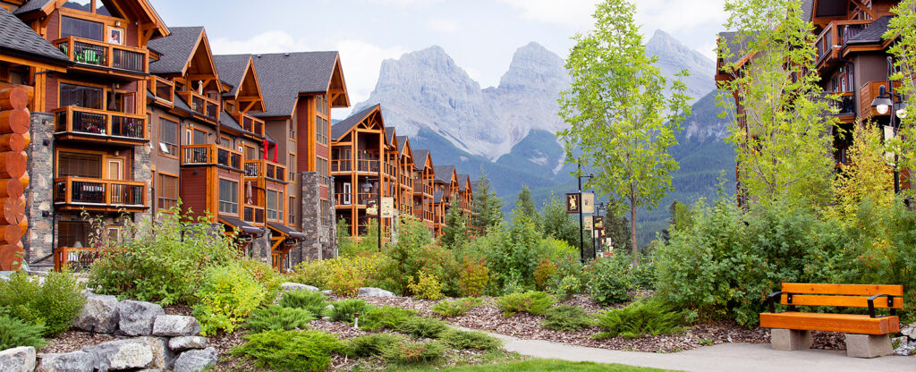 Summer or fall view of Origin at Spring Creek building with Three Sisters Mountains in the background